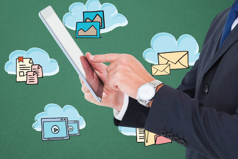 Business man on tablet deciding what marketing channels to use