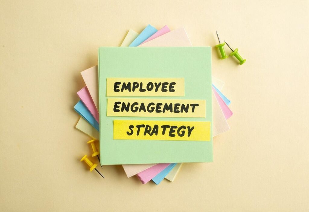 Employee engagement strategies written on post it note